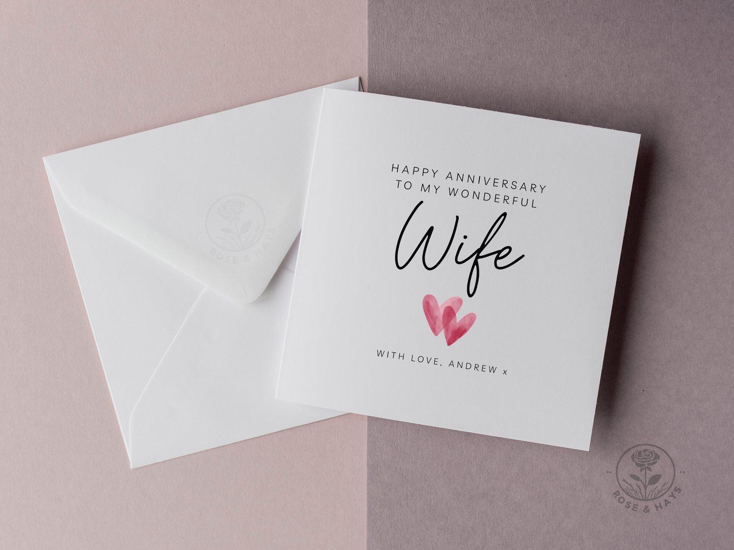 Greeting card with 'Happy Anniversary to my wonderful Wife' text and a heart illustration on a pink background.