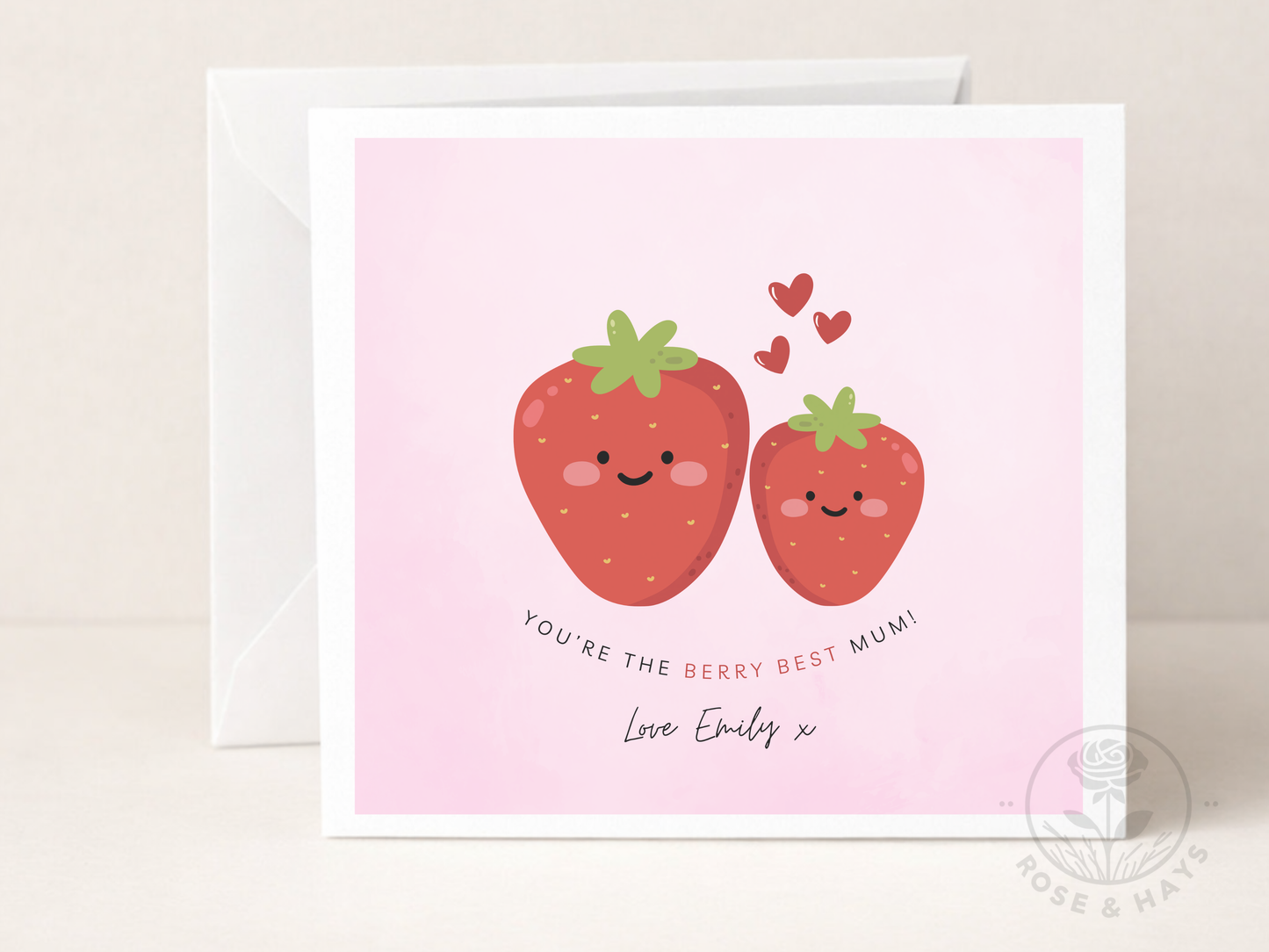 Greeting card with two smiling strawberries and hearts on a pink background