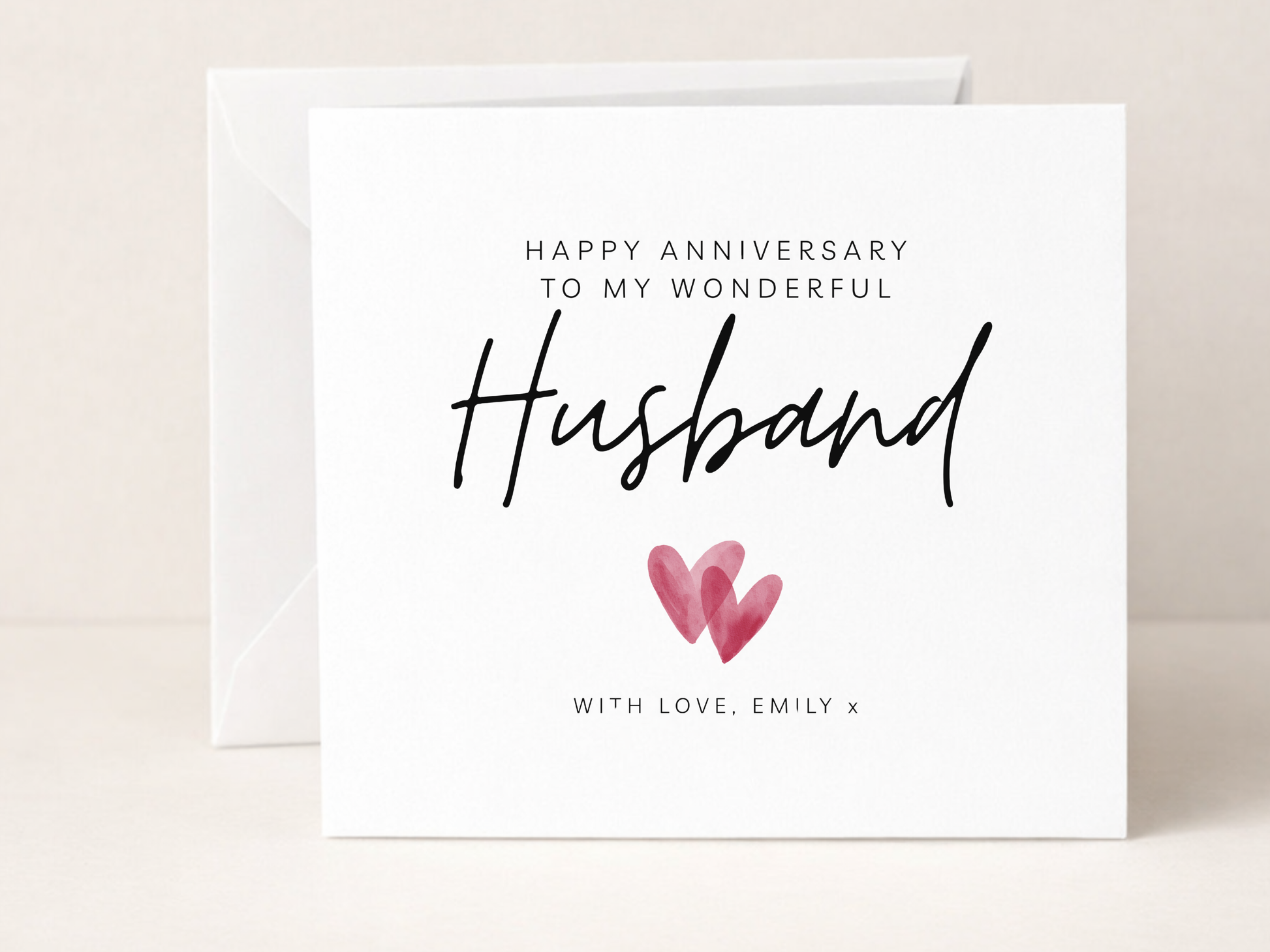 Greeting card for husband's anniversary with hearts and personalized text.