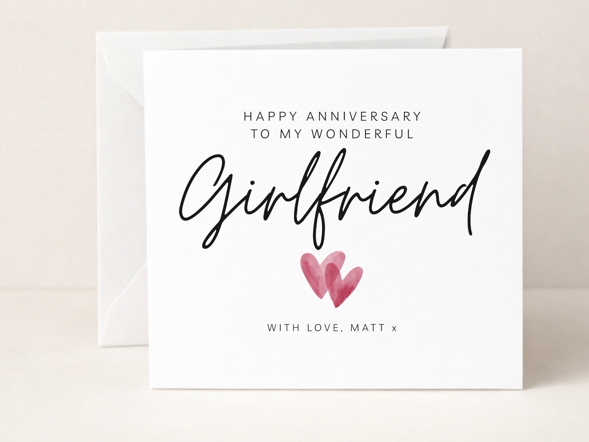 Greeting card with 'Happy Anniversary to my wonderful girlfriend' text and two hearts on a white background