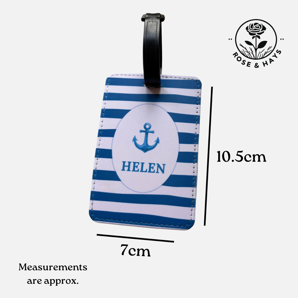 Personalized luggage tag with blue and white stripes, featuring a white oval center with a blue anchor and the name 'HELEN'. Dimension lines indicate 10.5 x 7cm