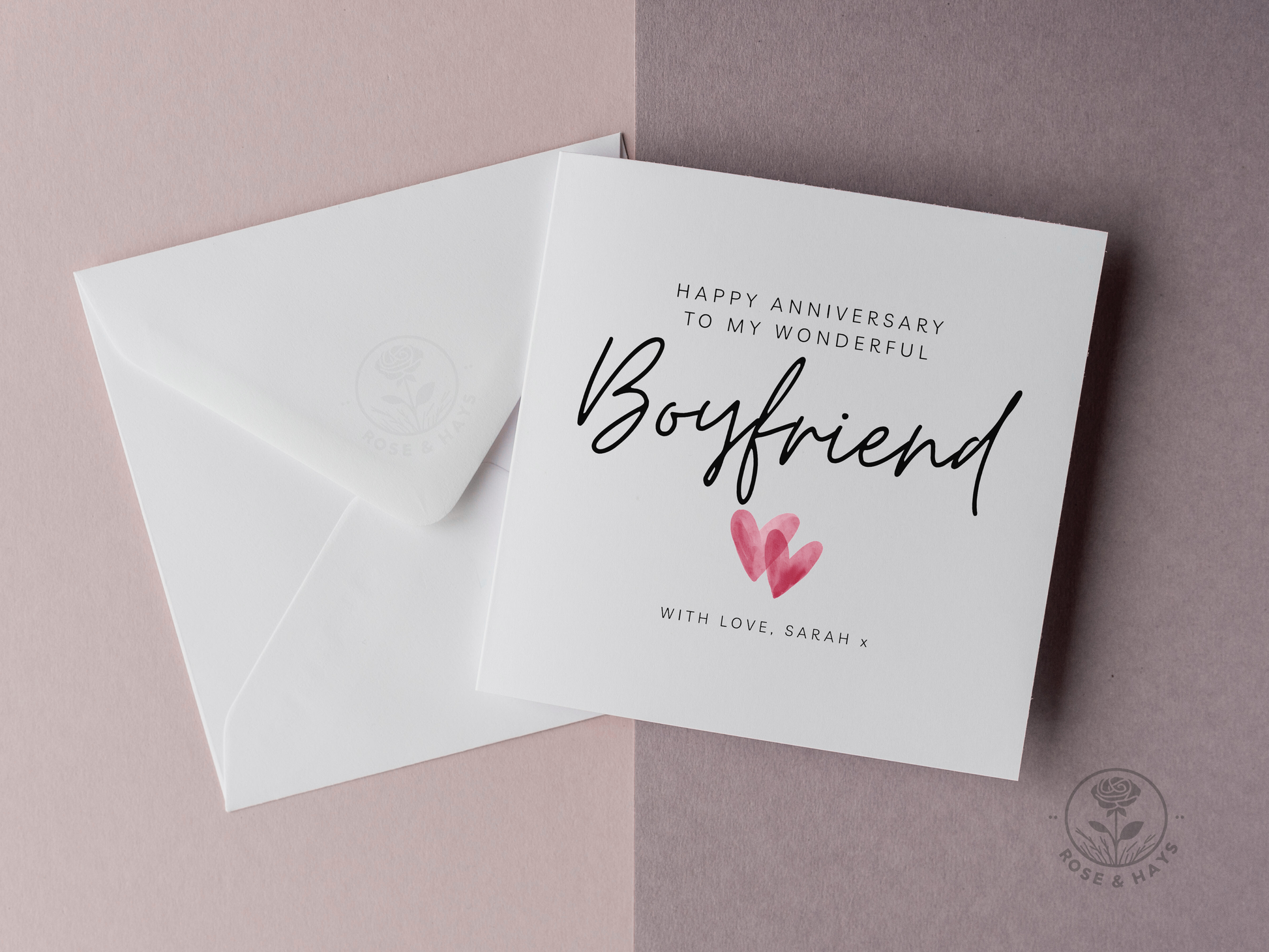 Greeting card with 'Happy Anniversary to my wonderful Boyfriend' text and a heart illustration on a pink background.