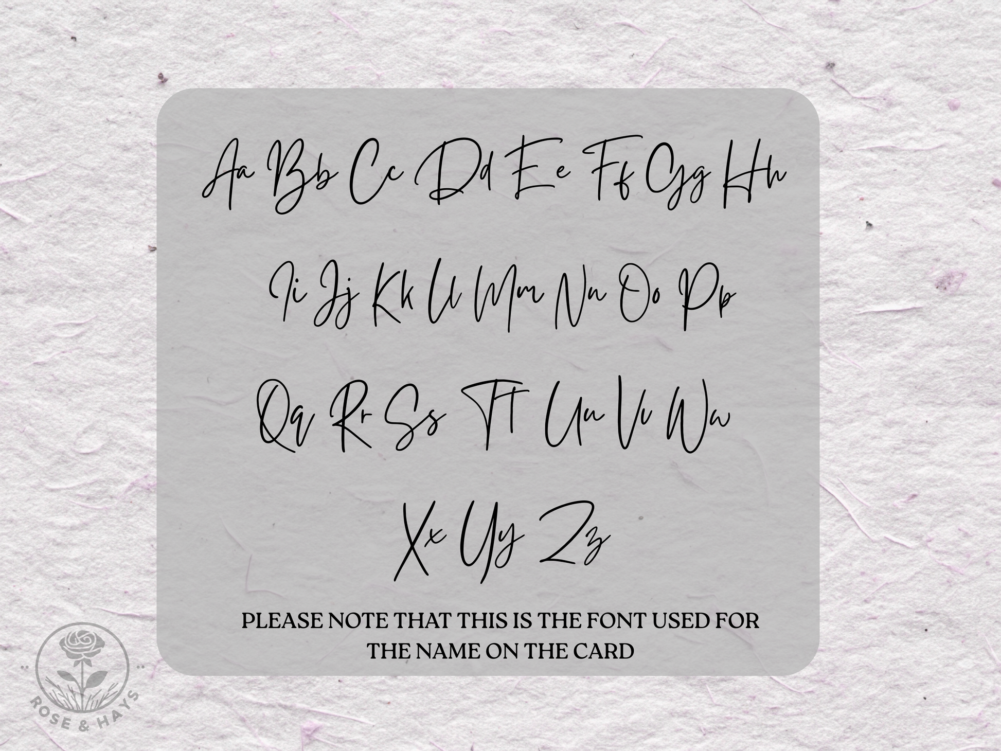 Stencil with script font letters on a textured gray background