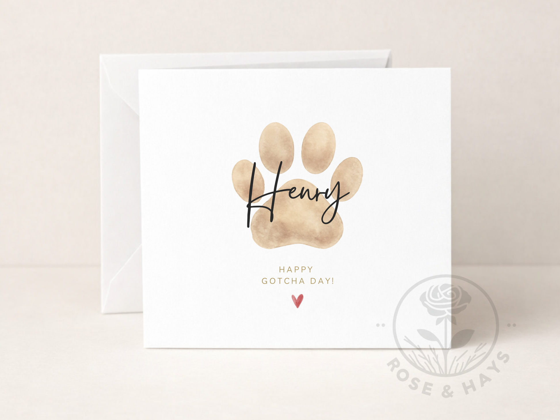 Greeting card with a paw print and 'Happy Gotcha Day!' text on a beige background