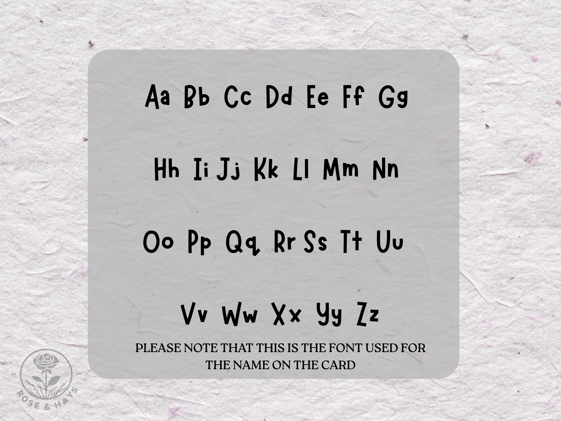 Alphabet card with black letters on a textured gray background